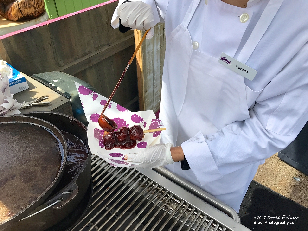 Meatballs on a stick smotherred in a Boysenberry BBQ sauce.