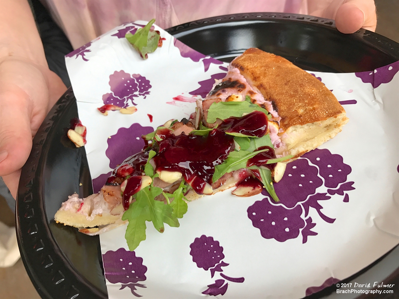 Boysenberry Cream Cheese sauce, diced chunks of black forest ham, carmelized onions, goat cheese, and arugula.  Topped off with a drizzle of Boysenberry Siracha sauce and almonds.  VERY unique and tasty!