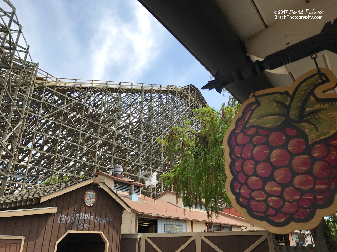 GhostRider train cresting the top of the lift hill.