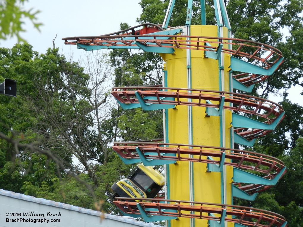 Toboggan cart making its way down the spiraling helix on the ride.