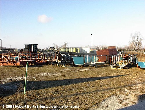 In this shot, we can see track sections of Screamin' Delta Demon in the background, Dulcimer Splash/Floom Zoom andn an unidentified ride in orange.