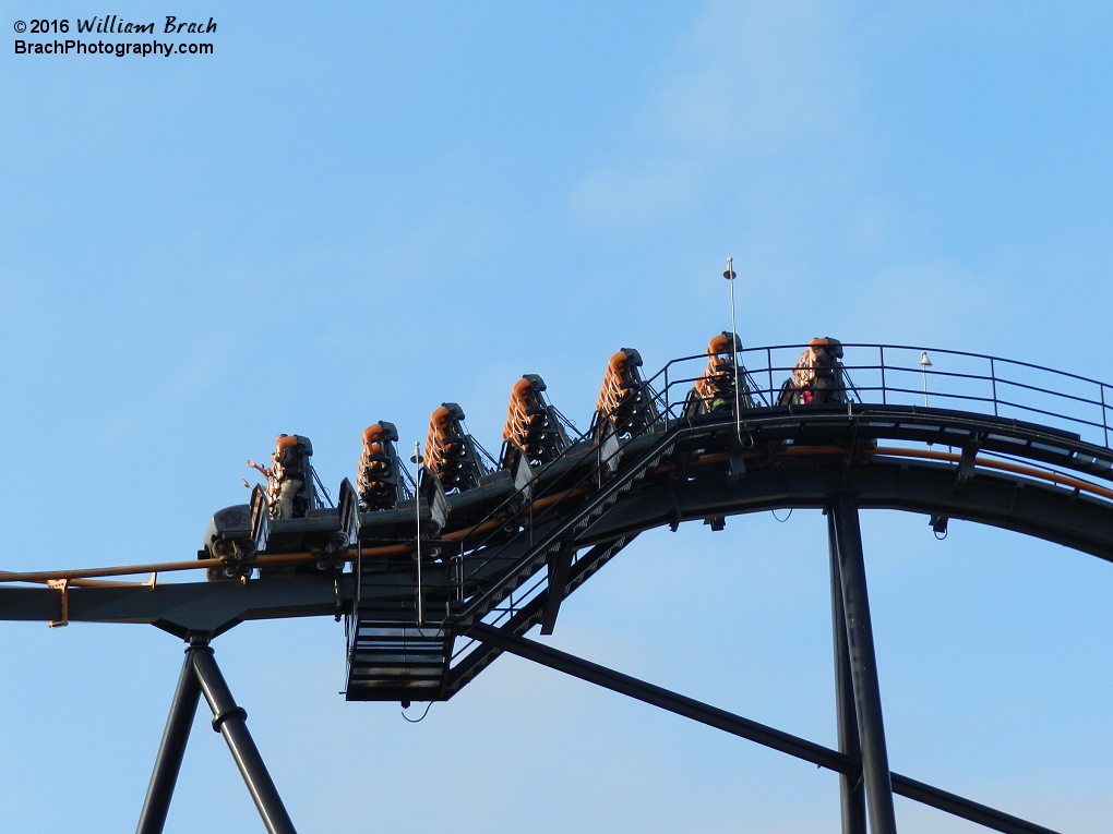 Apocalypse train cresting over the top of the lift hill.