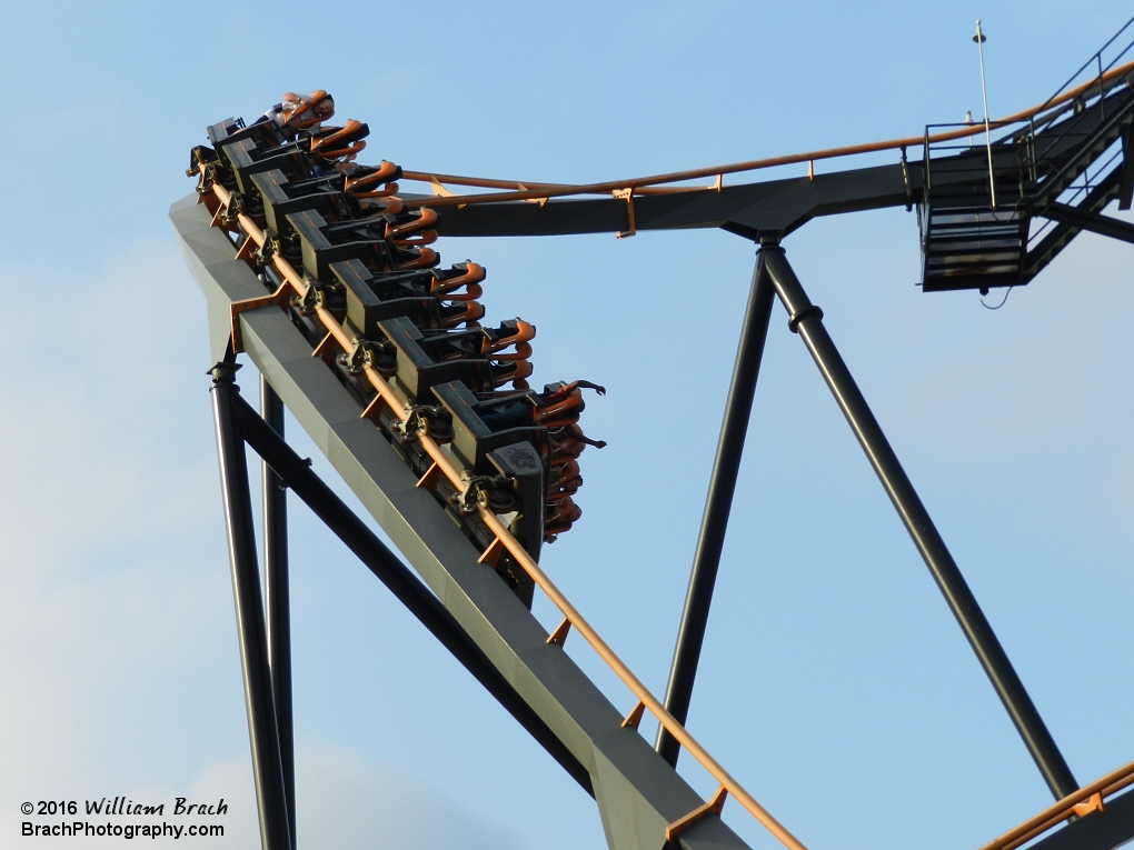 Train going into the diving first drop before the vertical loop.