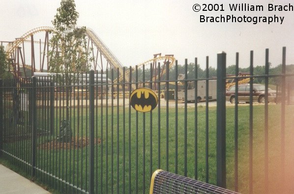 The Batman sign on the fencing on the path towards the ride's queue.