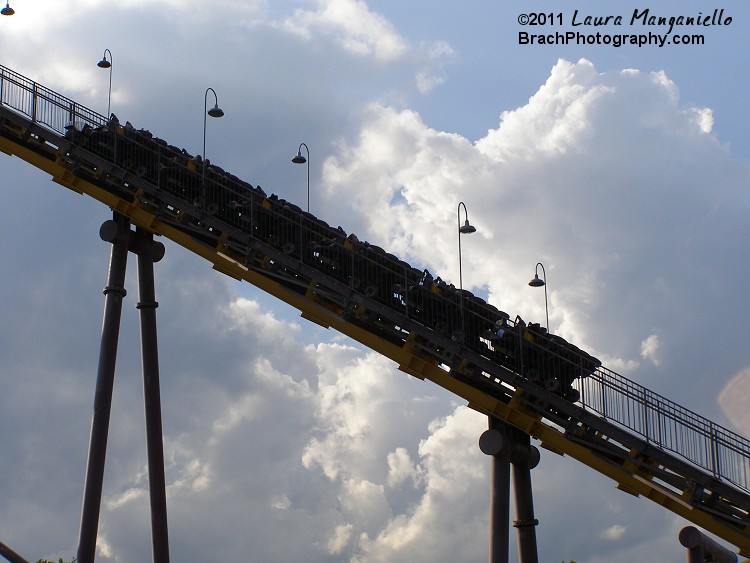 Batwing train climbing the lift hill.