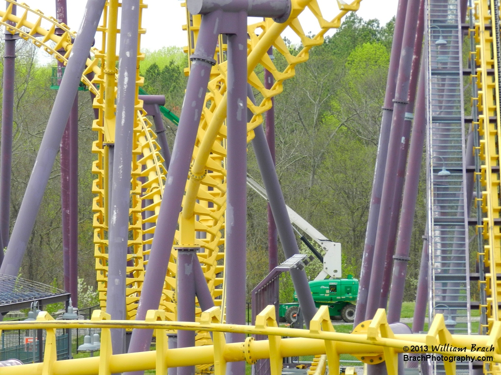 In the background, you can see a cherry picker extended to reach the track after the vertical loop.