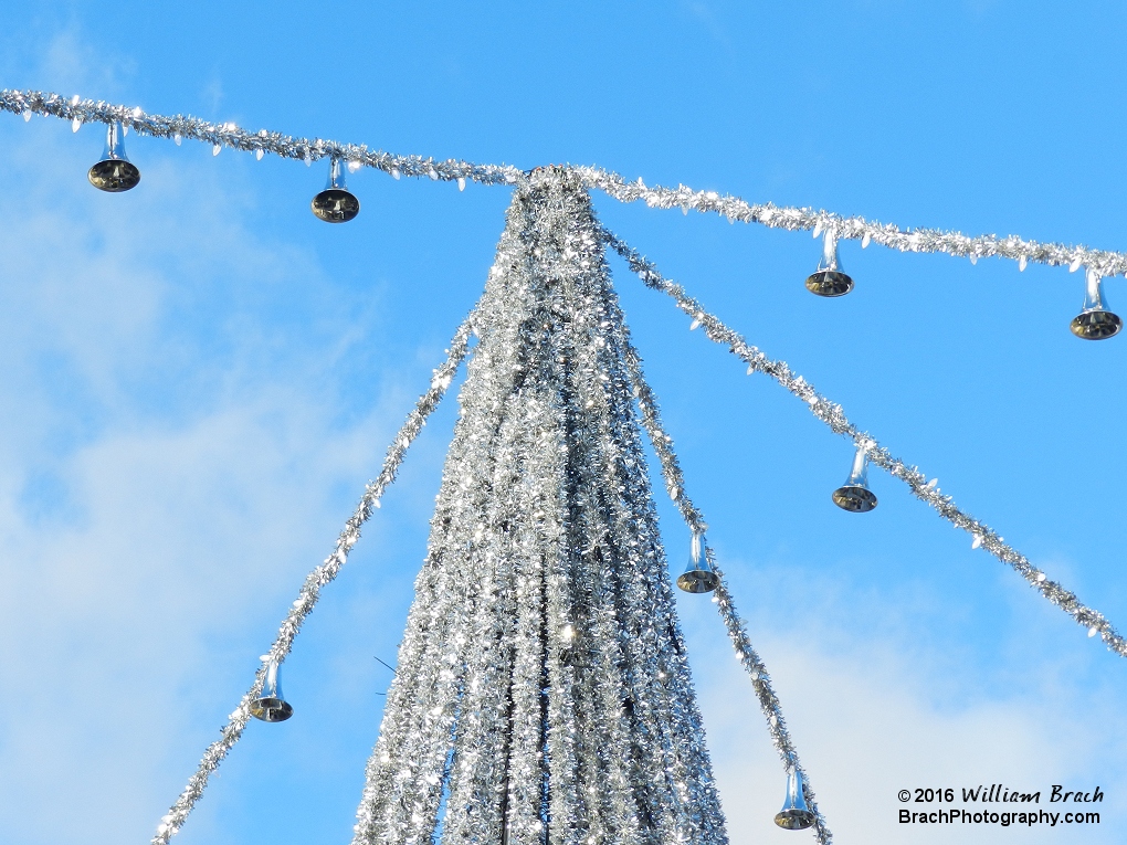 Silver Bells hanging on the silver garland.