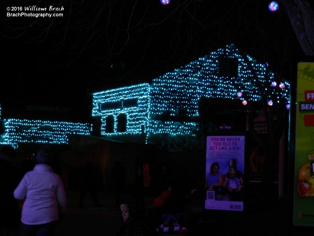 Station building lit up appropriately in light blue colored lights to resemble water.