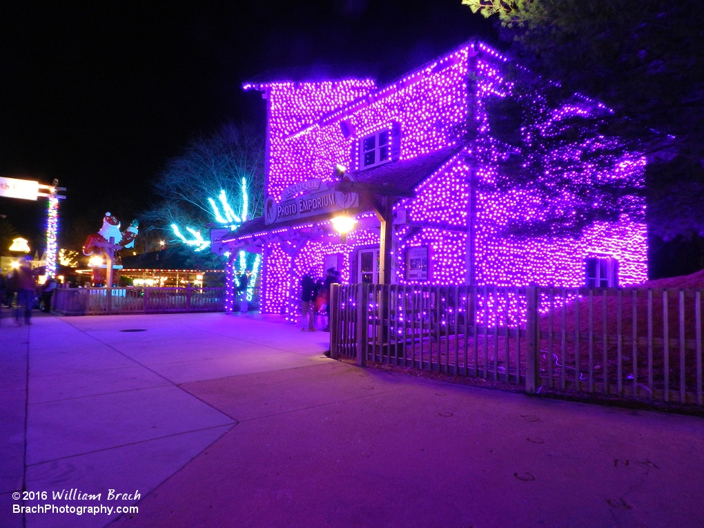 The Photo Emporium well lit up in purple lights.  Glad to see someone studied with Clark W. Griswold!