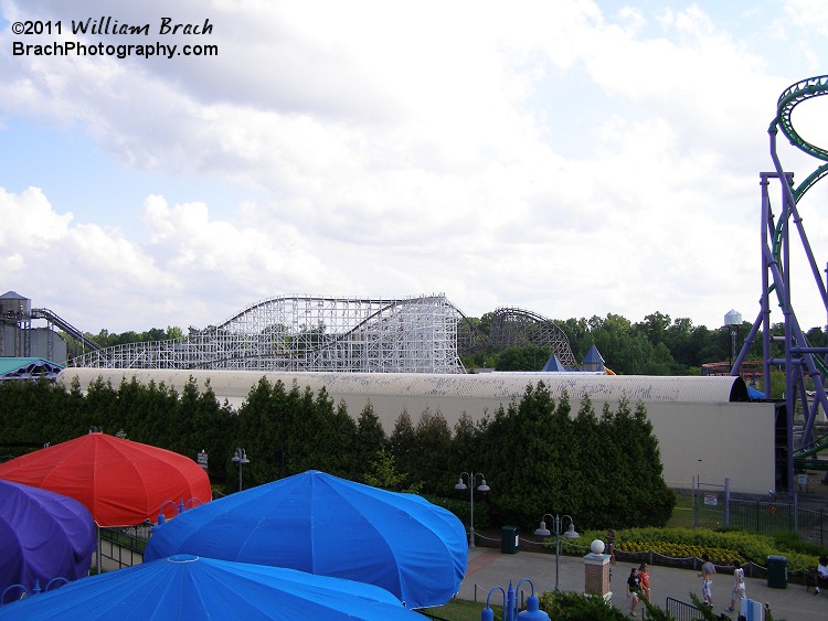 The launch tunnel for Joker's Jinx is nearly completely covered by trees.