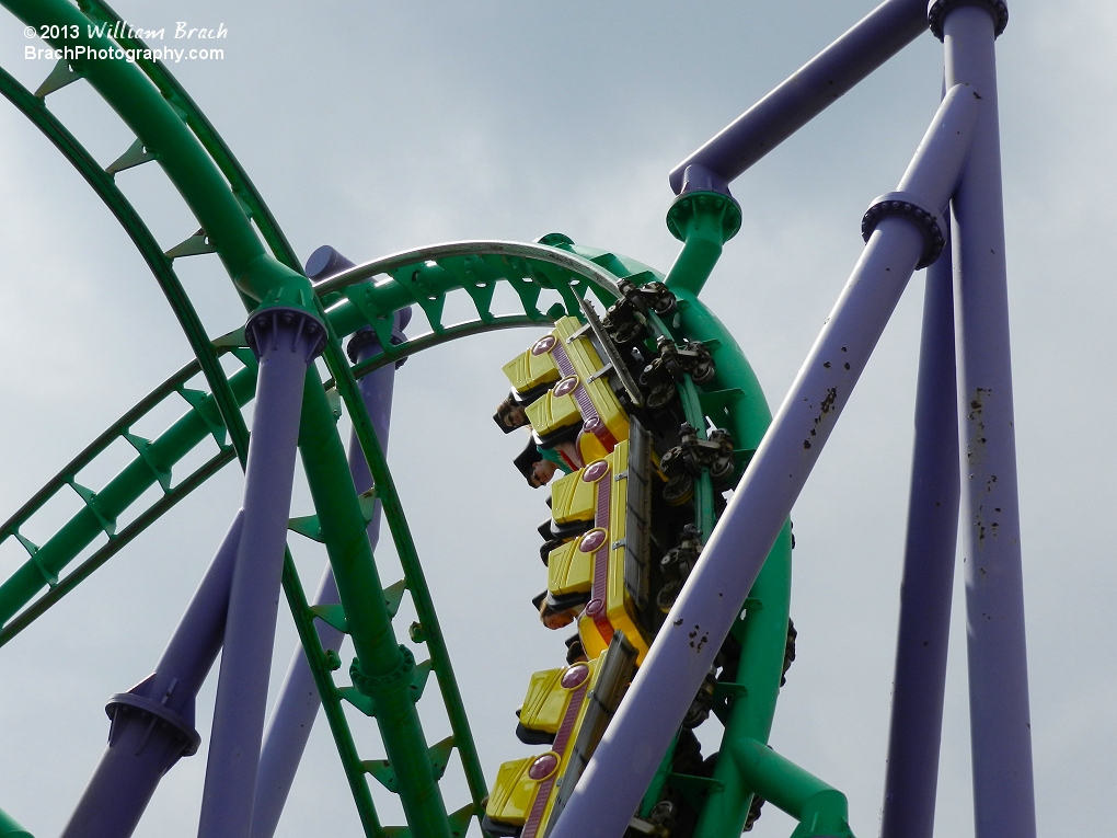 Yellow train running through one of the four inversions on the coaster.