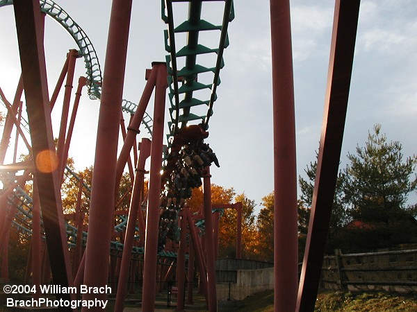 Mind Eraser is a standard "shelf" Suspended Looping Coaster (SLC) from Vekoma.  The same company that built Two Face in 1999, and Batwing in 2001.