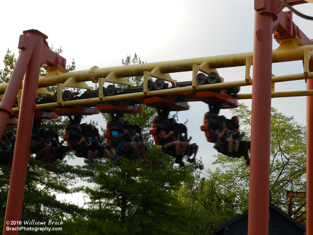 Mind Eraser orange train entering the straight track leading up to the brake runs.