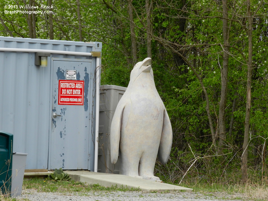 Concrete penguin from the Penguin's Blizzard River seen sitting in storage.