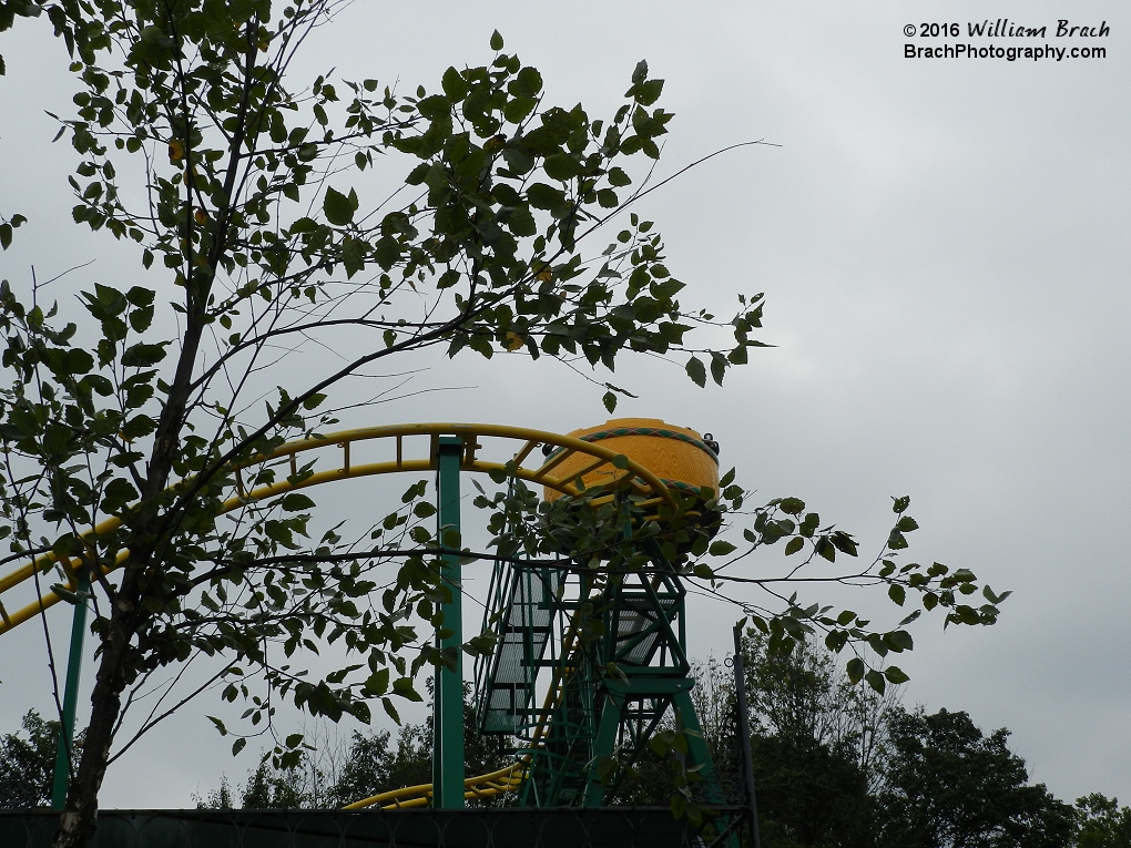 Yellow car making its way around the coasters course.