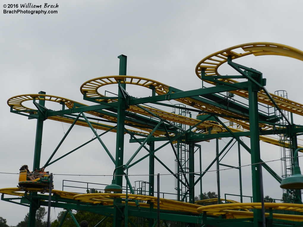 Yellow car entering the spinning portion of the ride.