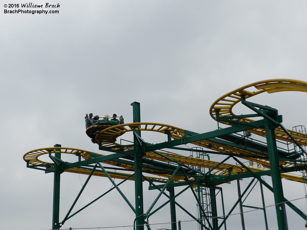 Green car running the wild mouse (non-spinning) portion of the ride.