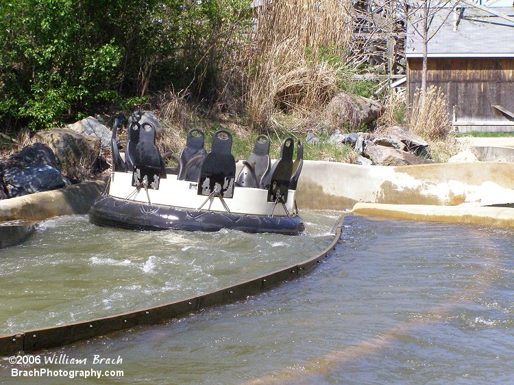 Empty rapids raft making its way down the track.