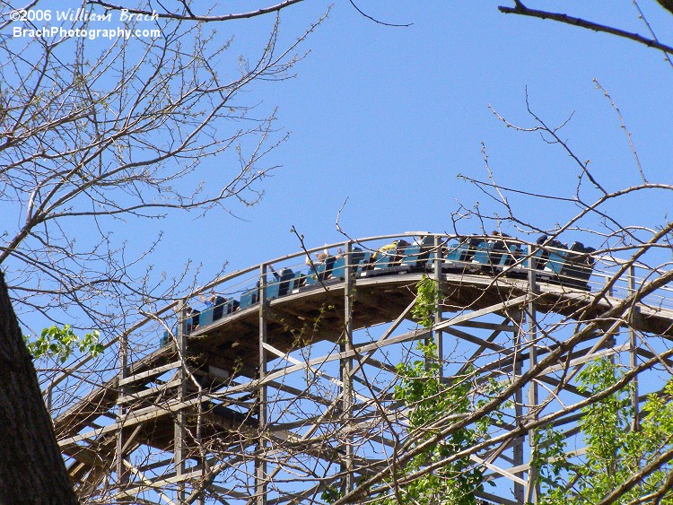 Blue train cresting the lift hill.