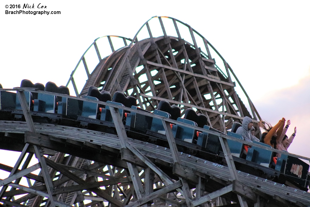 Riders enjoying a chilly ride on the wooden coaster.