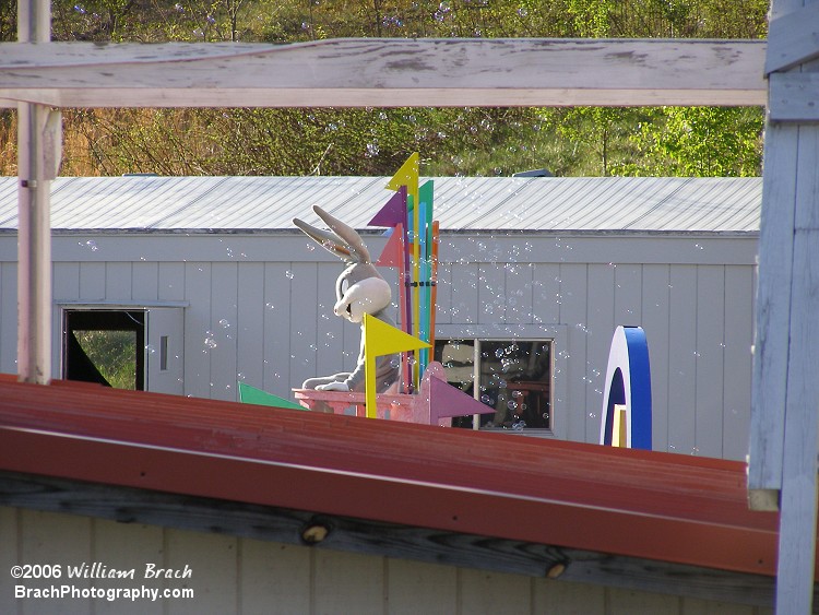 Bugs atop his throme on the raft with bubbles blowing all around him.