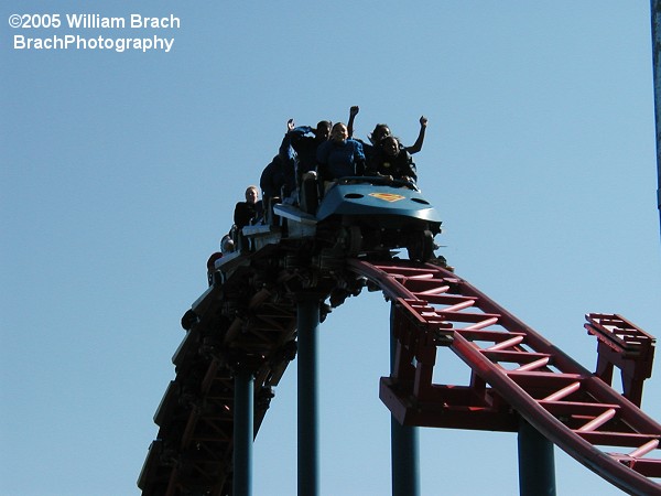 Superman: Ride of Steel's blue train hopping over the bunny hills.  That is a trim brake that's sticking up from the track near the lower right corner of the photo.