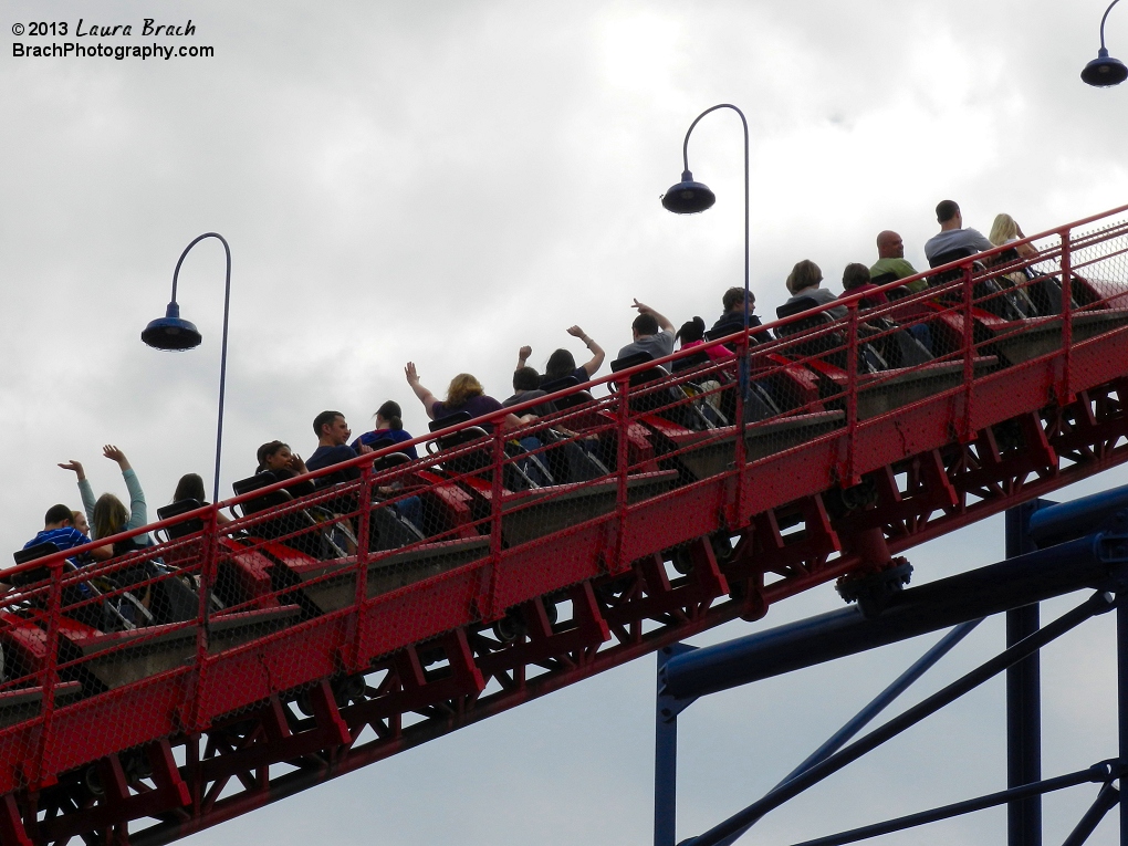 Superman: Ride of Steel's red train going up the lift hill.