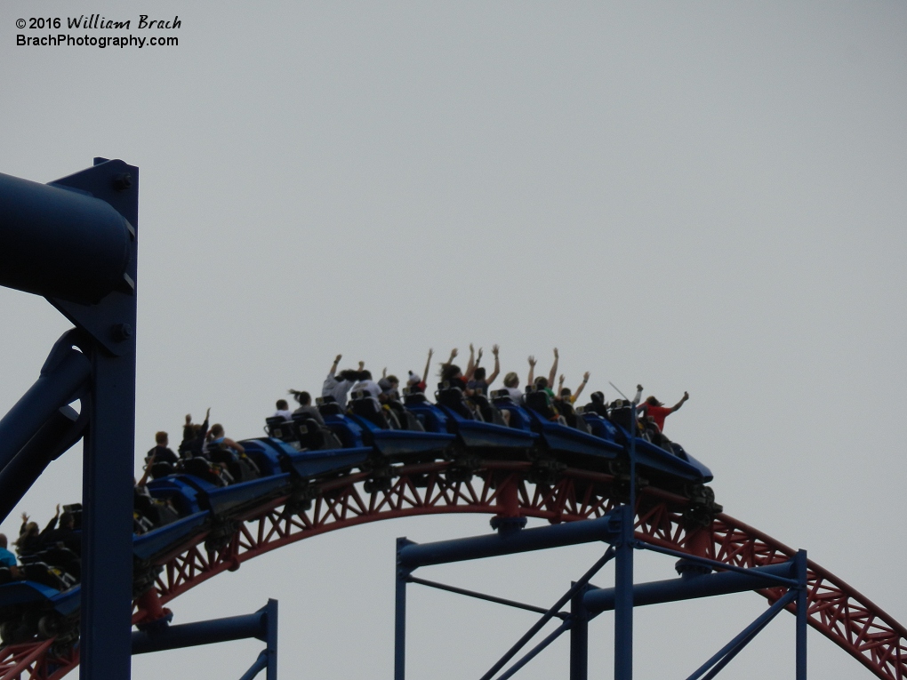 Blue train cresting the top of the second hill.  Those two people in the front row are filming with their cell phones.  I really hope those people lost them on the ride.