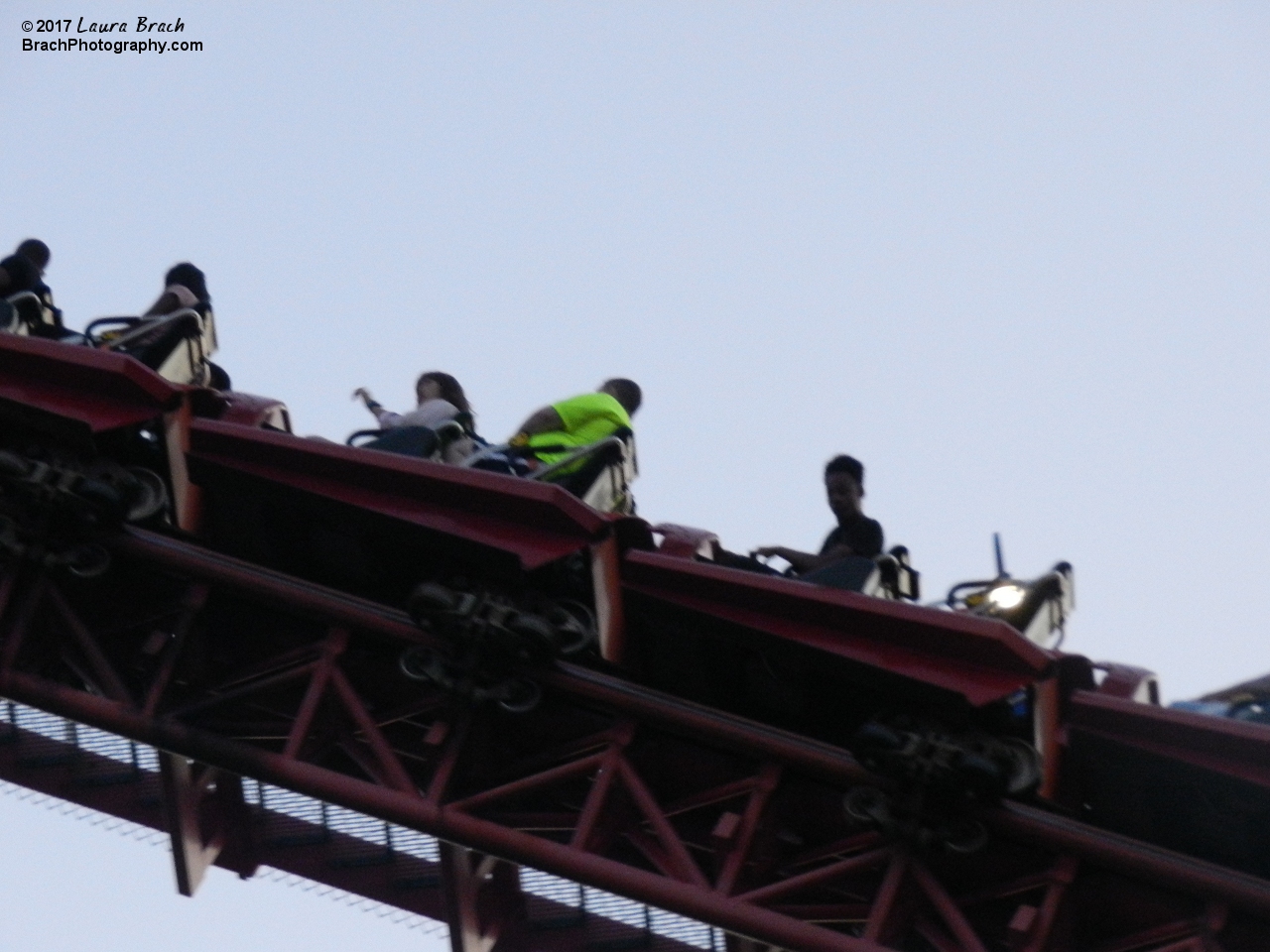 Will (bright yellow shirt) taking a ride on Superman: Ride of Steel.  Here he is going up the lift hill.