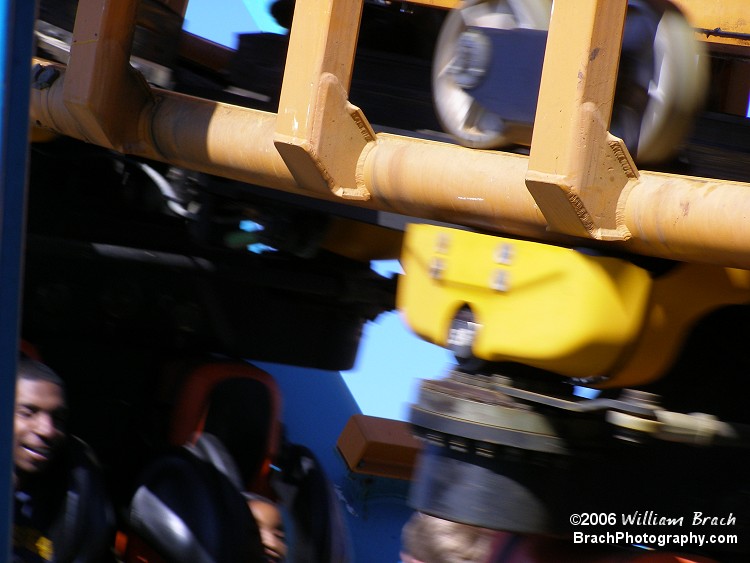 Detailed view of the track with the train car rolling by.