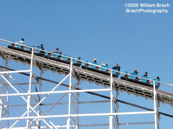 Blue train going up the lift hill.