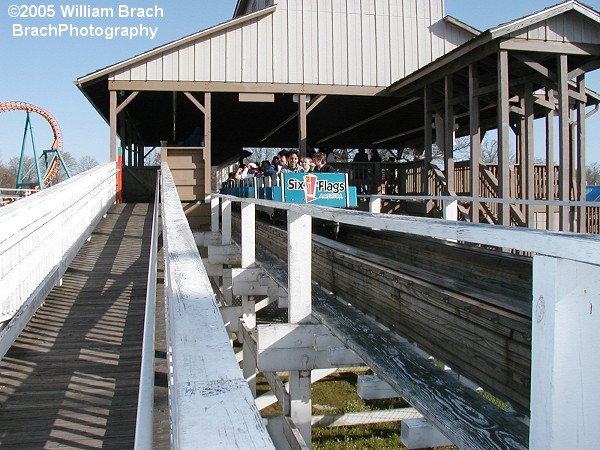 Blue train leaving the station.