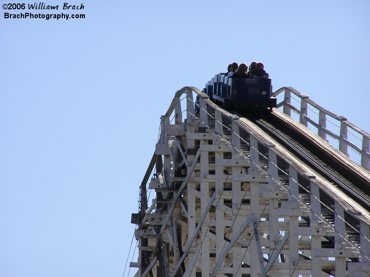 Blue train going up the lift hill.