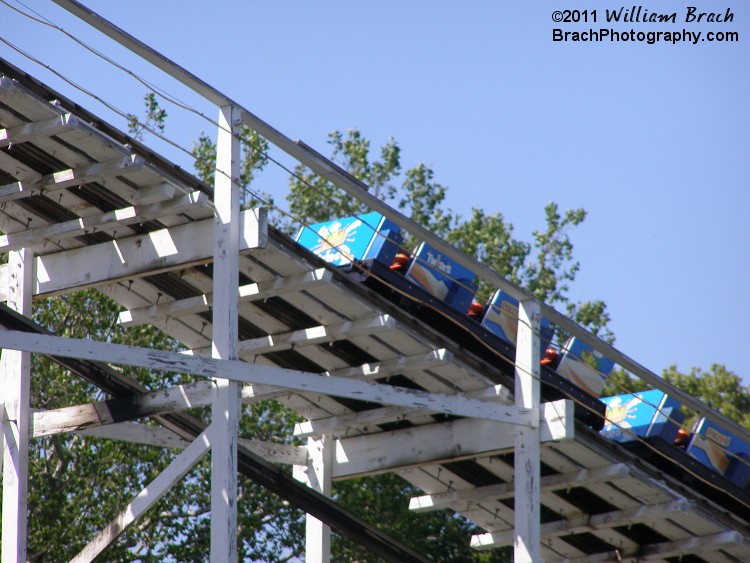 Wild One's blue train going up the lift hill.