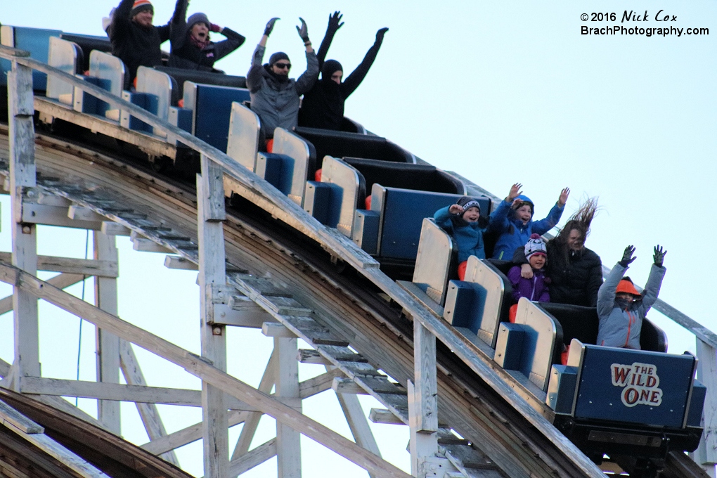 Riders enjoying a chilly ride on the wooden coaster.