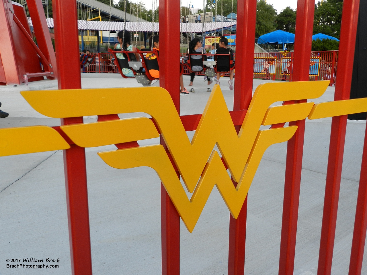 Wonder Woman logo on the fence around the ride.