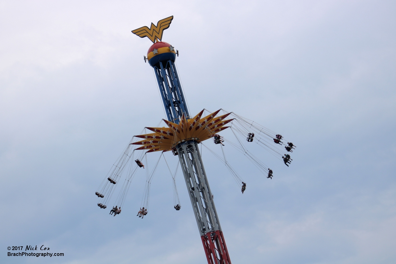 Wonder Woman flying around the structure.