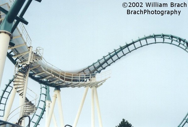 Train running through the cobra roll at dusk.