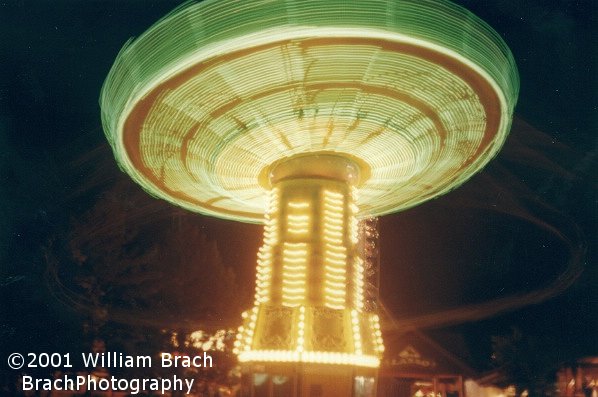 Lasso lit up in green lights in motion at night.