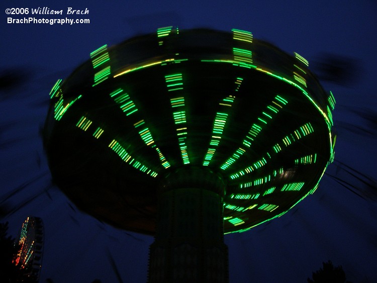 Green Lasso lights in motion at night.