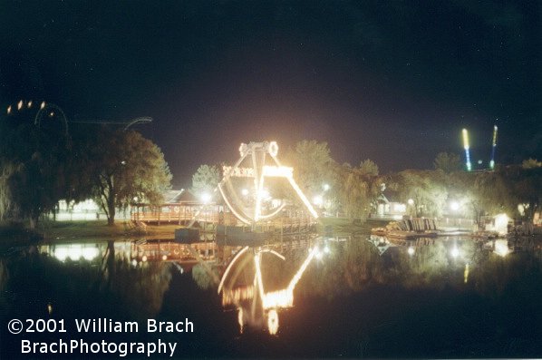 Beautiful night time shot of the Pirate ride from across Fun Lake.