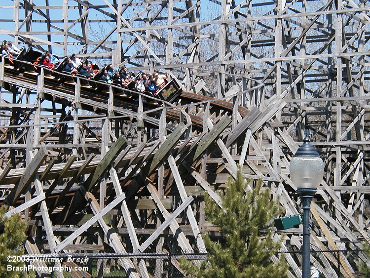 Predator's black train runs through the turnaround.  Predator is a double-out-and-back wooden coaster.