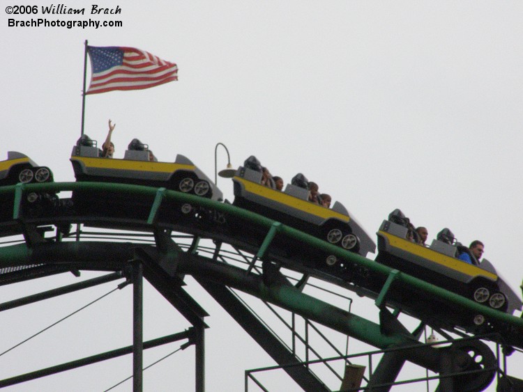 Viper's yellow train cresting the lift hill.