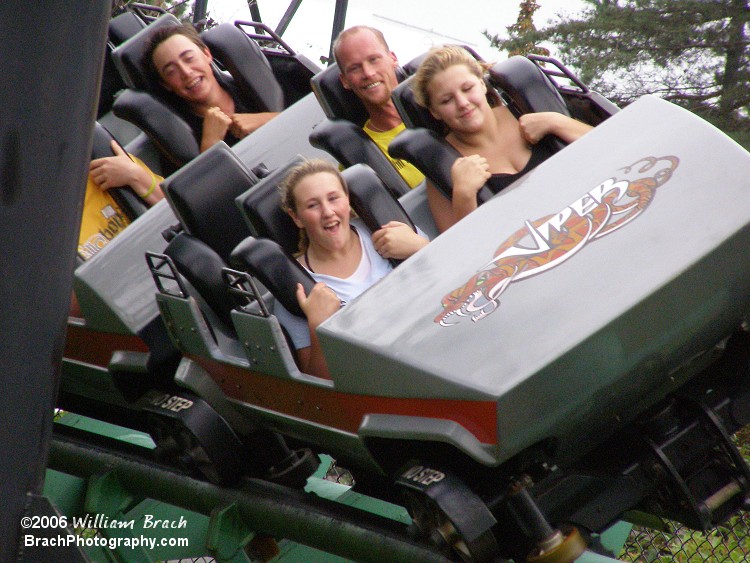 Red train making its way to the helix with happy riders on board.