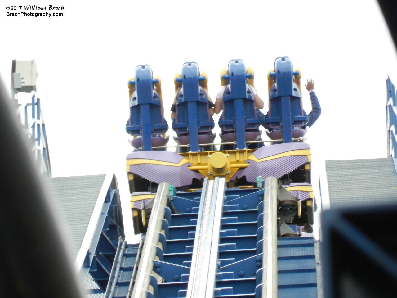 Bizarro train cresting over the top of the lift hill.