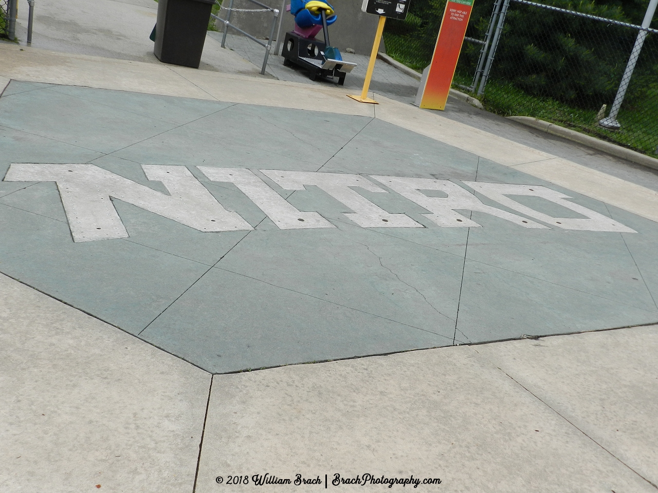 Neat sign implanted into the concrete outside of Nitro's entrance.