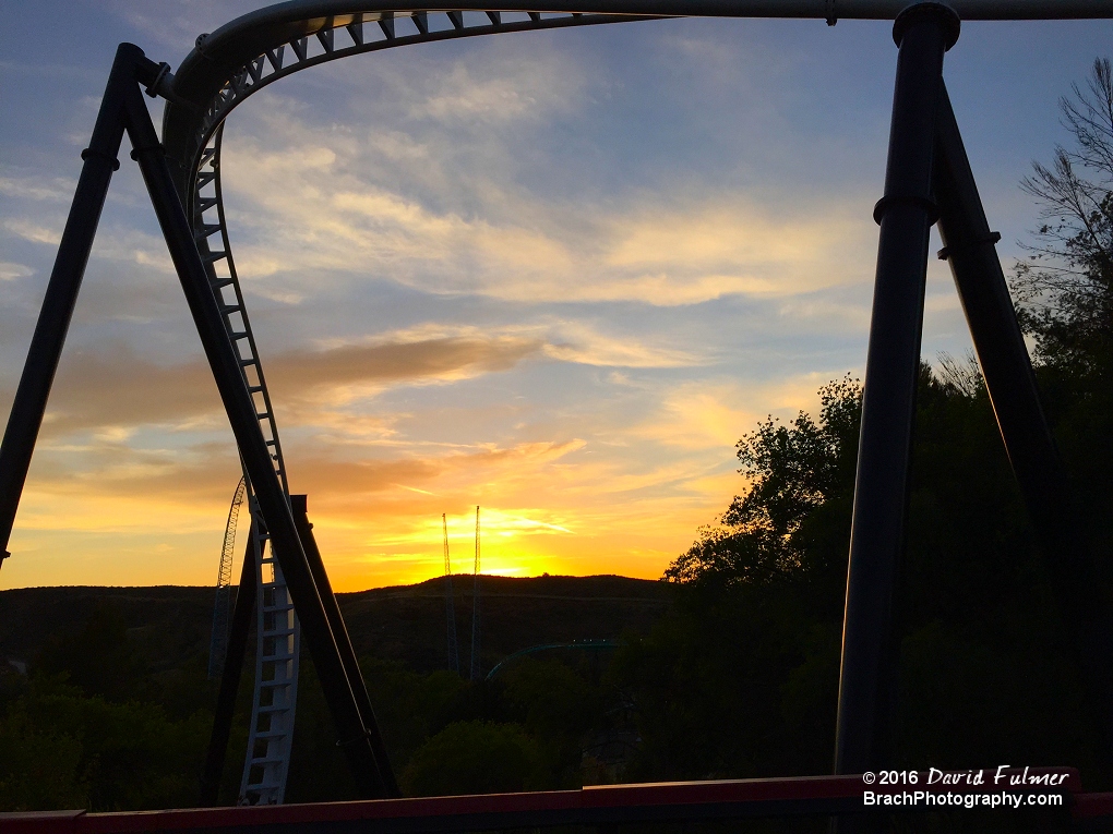 Full Throttle in the foreground as the sun sets over the Pacific Ocean.