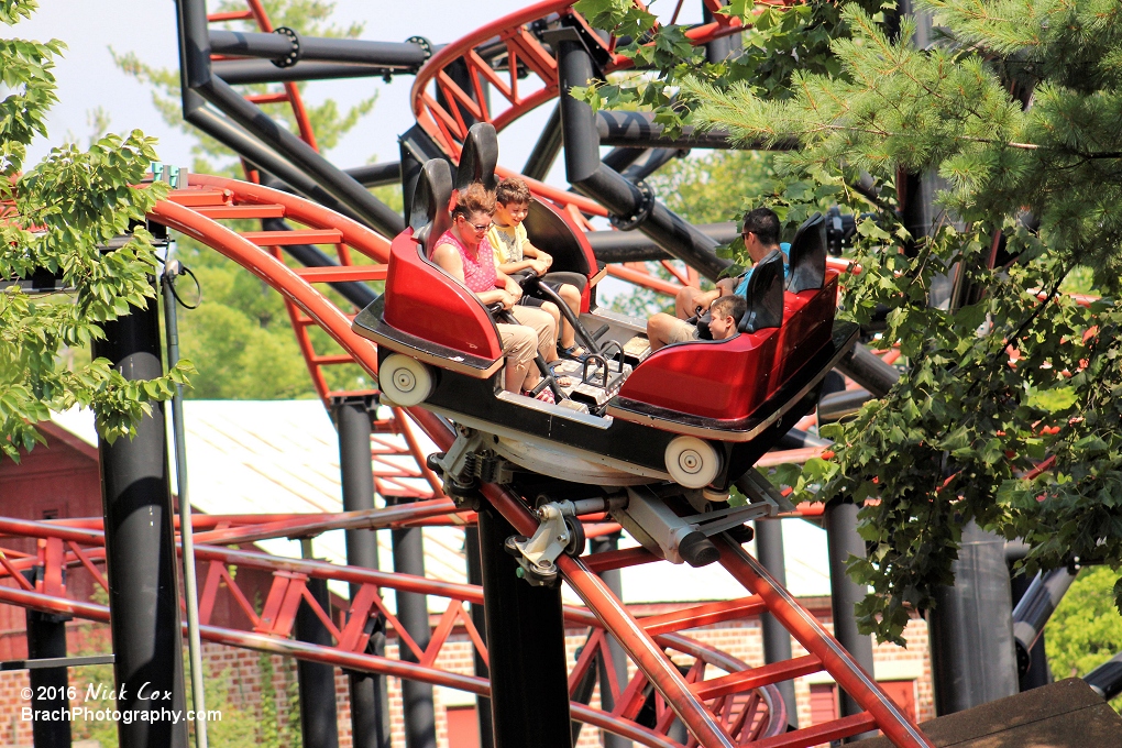 Riders taking a spin and a drop at the same time.