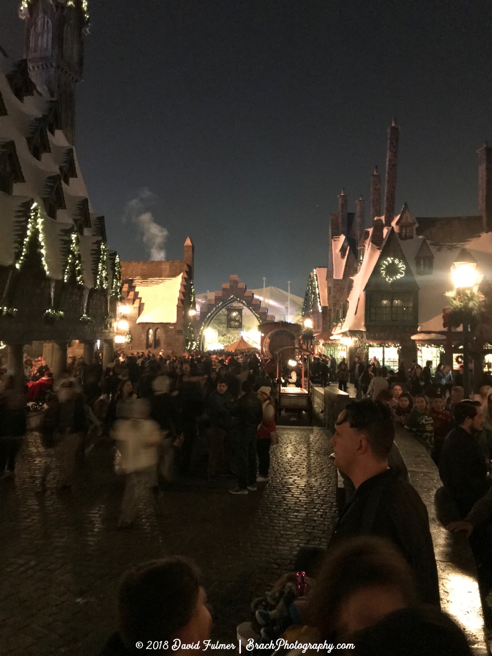 Hogsmeade all lit up at night.