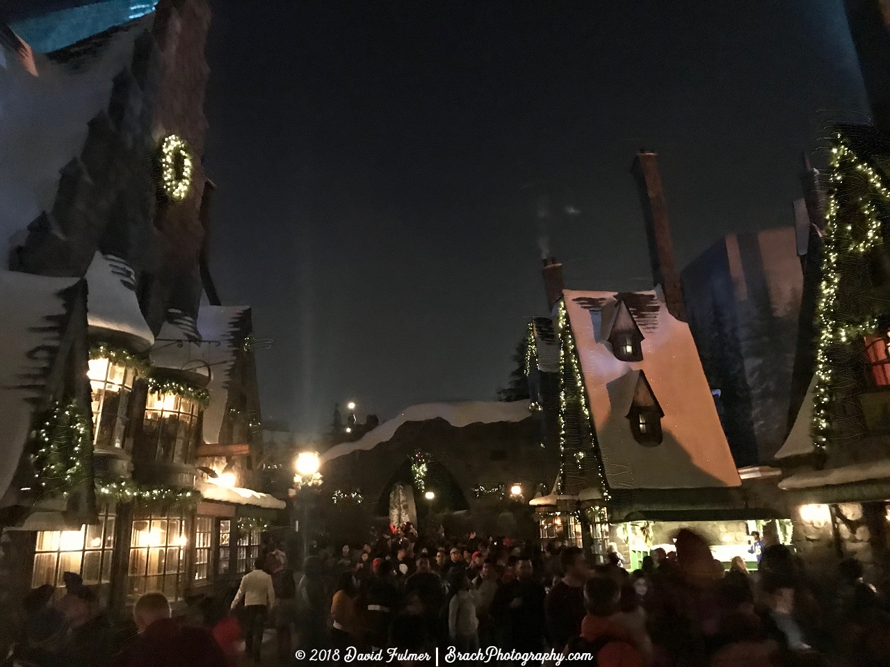 Hogsmeade all lit up at night.